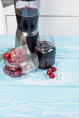 Image of Cherry juice with glass of berries