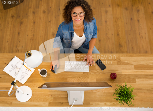 Image of Businesswoman working at the office