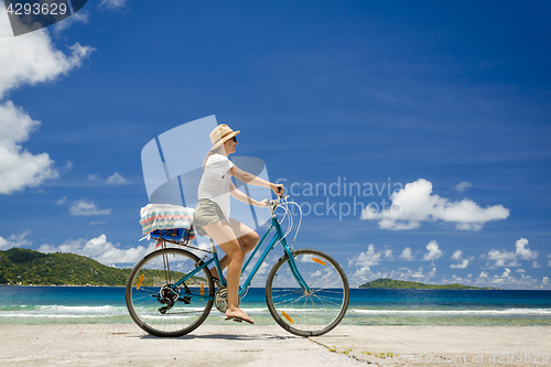 Image of Woman ride along The Beach