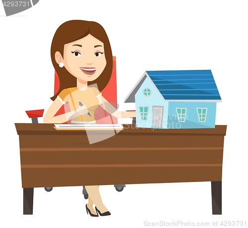 Image of Real estate agent signing home purchase contract.