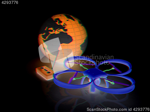 Image of Quadrocopter Drone with Earth Globe and remote controller on a w