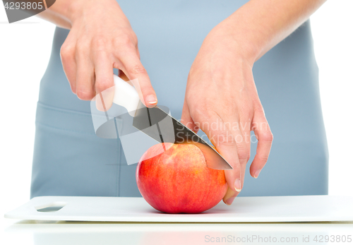 Image of Cook is chopping apple