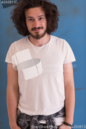 Image of young man with funny hair over color background