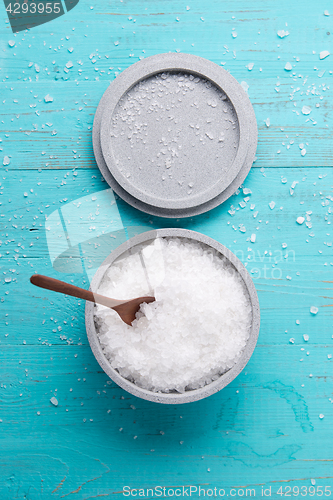 Image of sea salt on wooden background