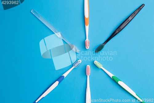 Image of Colorful toothbrushes , place for inscription