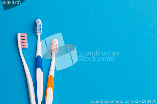 Image of Three toothbrushes, place for inscription