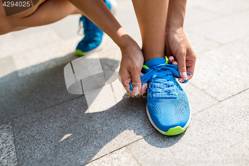 Image of Woman trying the shoestrings