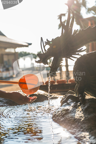 Image of Washing hand in Japan temple ladles