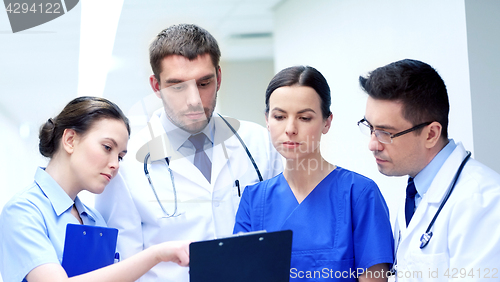 Image of group of medics at hospital with clipboard