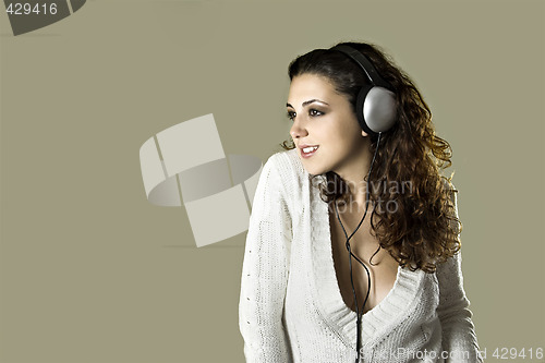 Image of Sexy woman listening music