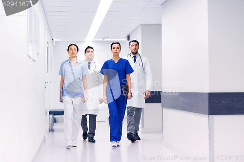 Image of group of medics or doctors at hospital corridor