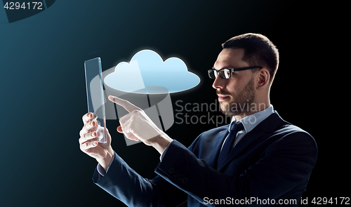 Image of businessman working with transparent tablet pc