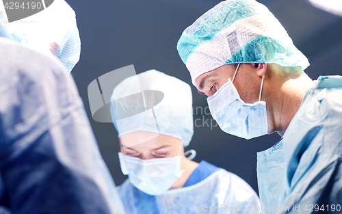 Image of group of surgeons in operating room at hospital