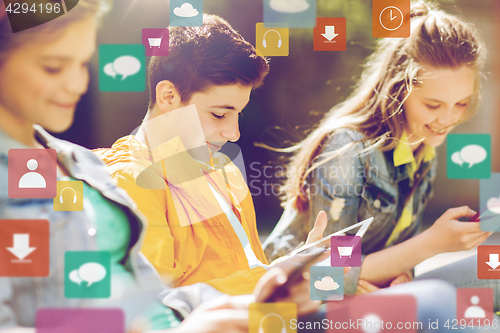 Image of happy friends with tablet pc computer outdoors