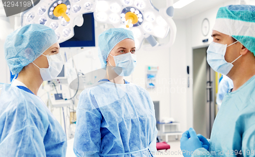 Image of group of surgeons in operating room at hospital