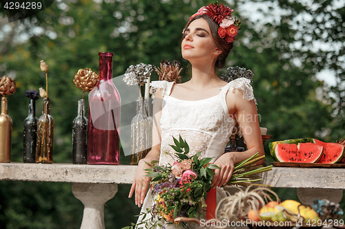 Image of Wedding decoration in the style of boho, floral arrangement, decorated table in the garden.