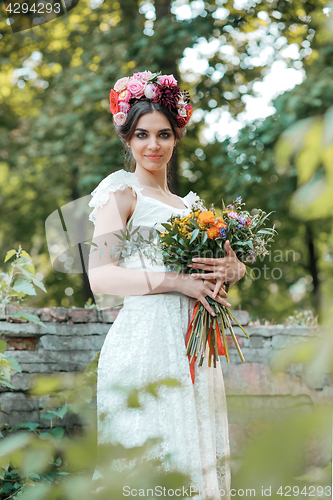 Image of Wedding decoration in the style of boho, floral arrangement, decorated table in the garden.