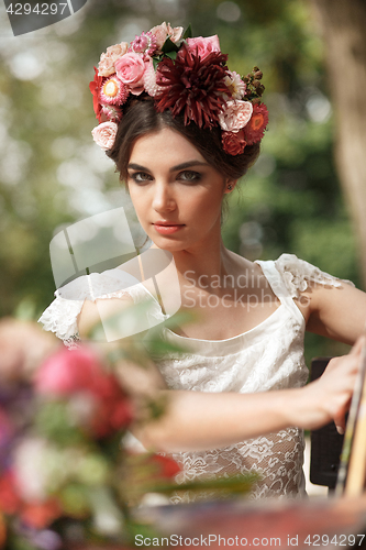 Image of Wedding decoration in the style of boho, floral arrangement, decorated table in the garden.