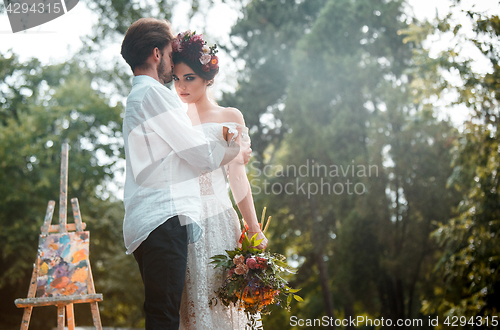 Image of Wedding decoration in the style of boho, floral arrangement, decorated table in the garden.