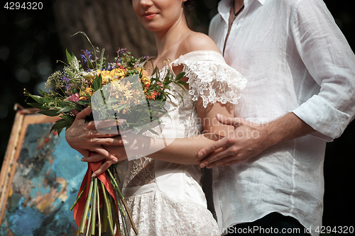 Image of Wedding decoration in the style of boho, floral arrangement, decorated table in the garden.