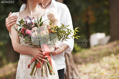 Image of Wedding decoration in the style of boho, floral arrangement, decorated table in the garden.