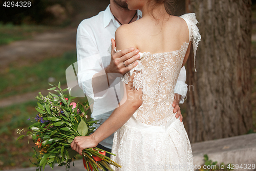 Image of Wedding decoration in the style of boho, floral arrangement, decorated table in the garden.