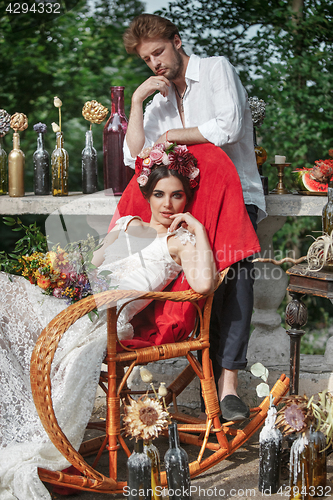 Image of Wedding decoration in the style of boho, floral arrangement, decorated table in the garden.