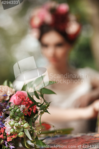 Image of Wedding decoration in the style of boho, floral arrangement, decorated table in the garden.