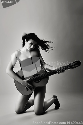 Image of Sexy woman with a guitar