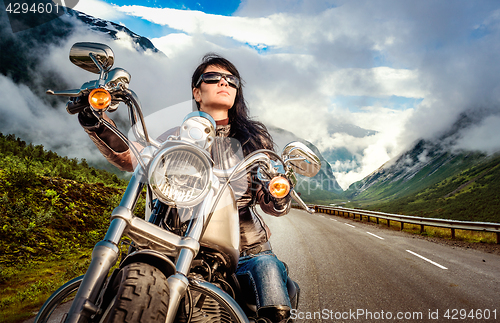 Image of Biker girl on a motorcycle