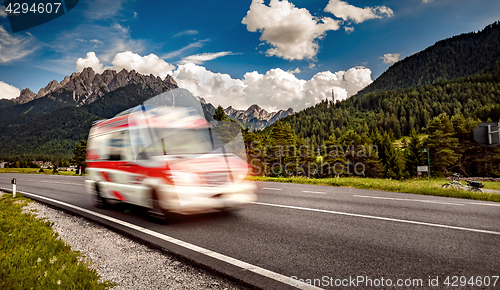 Image of Ambulance van rushes down the highway