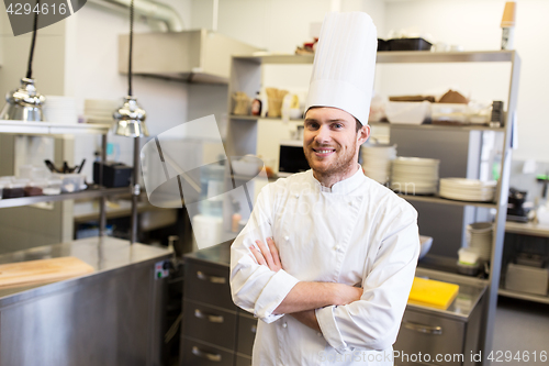 Image of happy male chef cook at restaurant kitchen