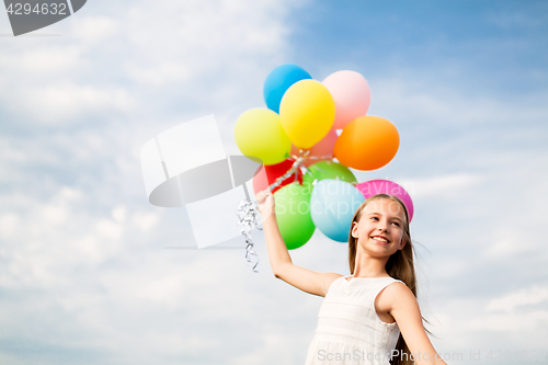 Image of happy girl in sunglasses with air balloons
