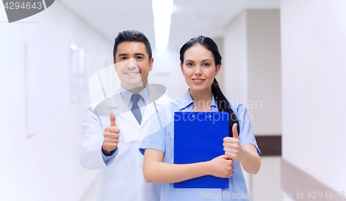 Image of doctor and nurse showing thumbs up at hospital