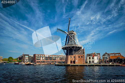 Image of Harlem landmark windmill De Adriaan on Spaarne river. Harlem,