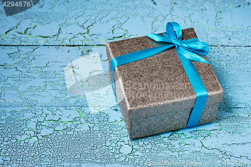 Image of Gift box with blue ribbon