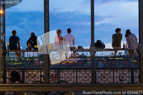 Image of Young couples on romantic date on urban railway bridge, Munich, Germany.