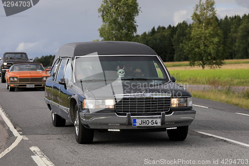 Image of Tuned Cadillac Fleetwood Funeral Car on Cruise Event