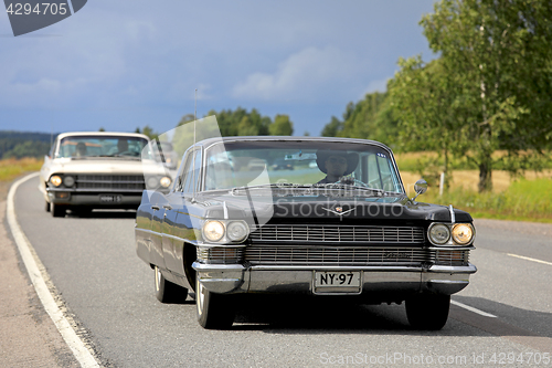 Image of Black Cadillac Car Cruising on Highway