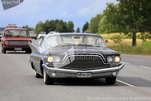 Image of Black Desoto Adventurer Classic Car on Road