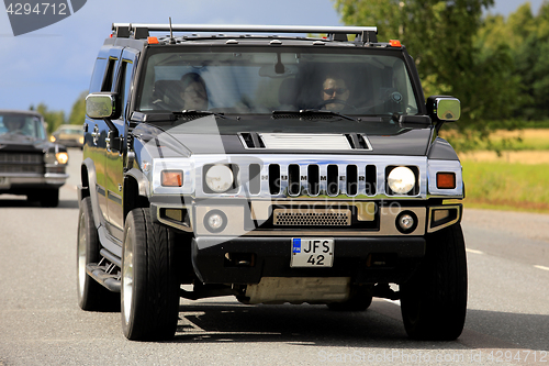 Image of Hummer H2 Truck on the Road