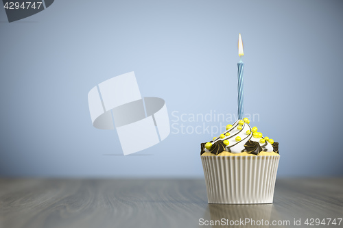 Image of sweet cupcake with a candle