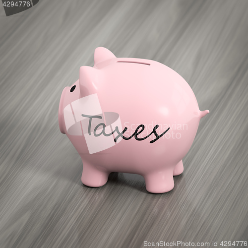 Image of a pink piggy bank with the word taxes