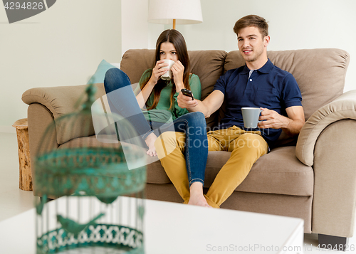 Image of Watching tv and drinking coffee