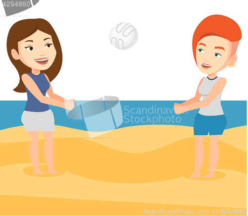 Image of Two women playing beach volleyball.