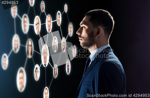 Image of businessman looking at contacts network