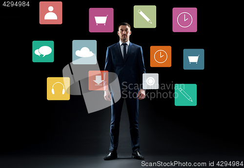 Image of businessman in suit over virtual menu icons