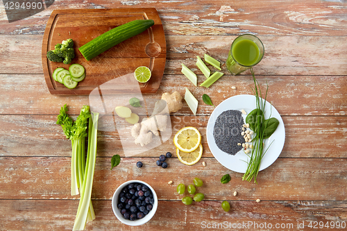 Image of fruits, berries and vegetables on wooden table