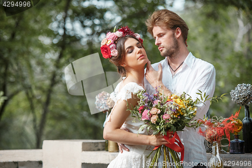 Image of Wedding decoration in the style of boho, floral arrangement, decorated table in the garden.