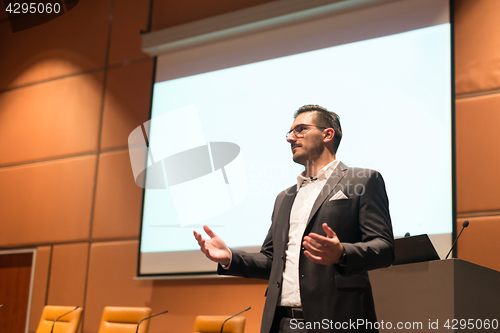 Image of Speaker giving talk at Business Conference.